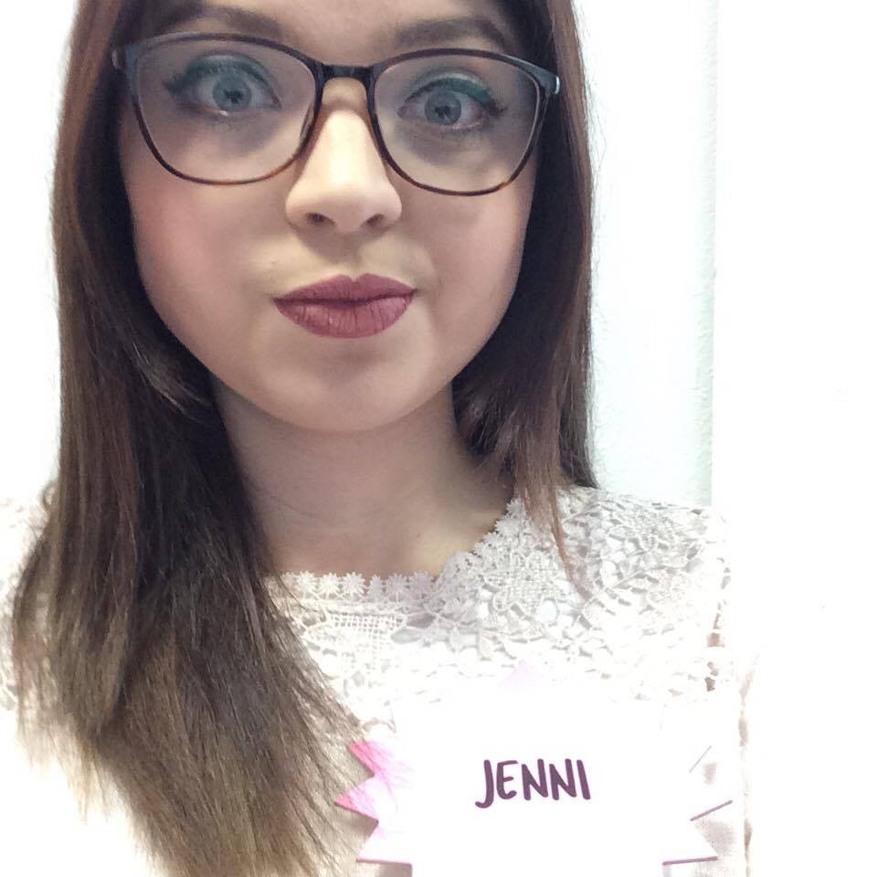 A selfie of Jenni wearing glasses.