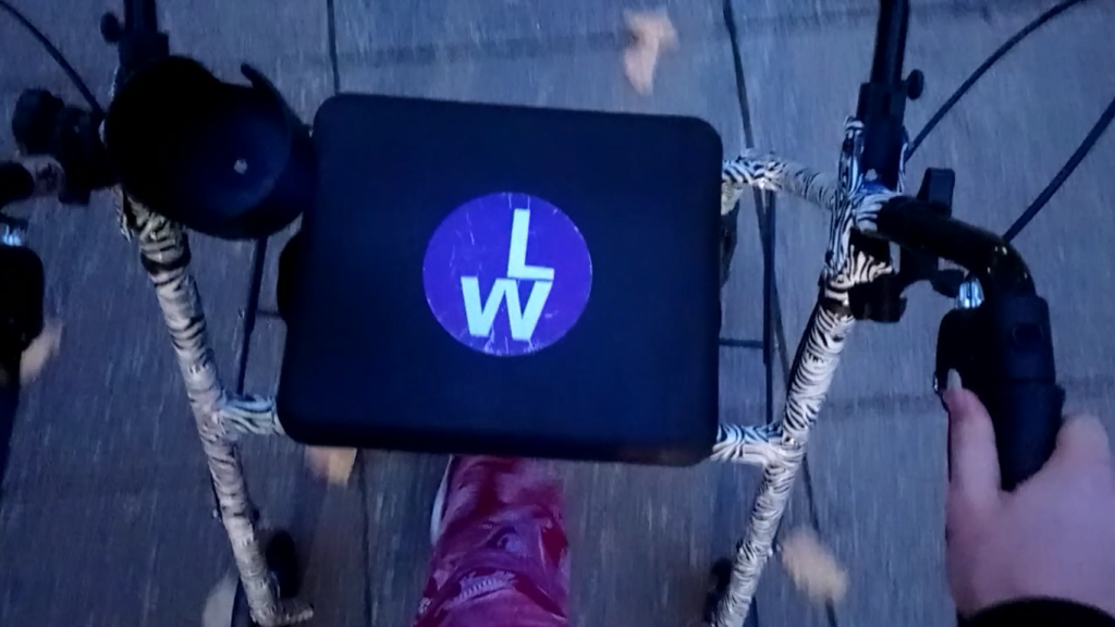 A close-up of a sign that says 'LW'