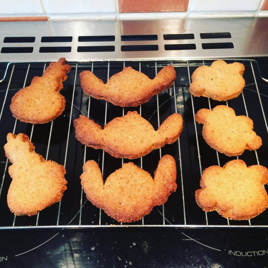 Various shaped biscuits, including Disneys Stitich.