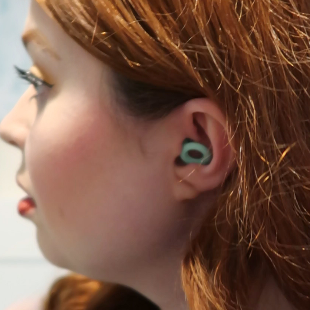 A close-up of Jennis ear, with her Loop earbud in