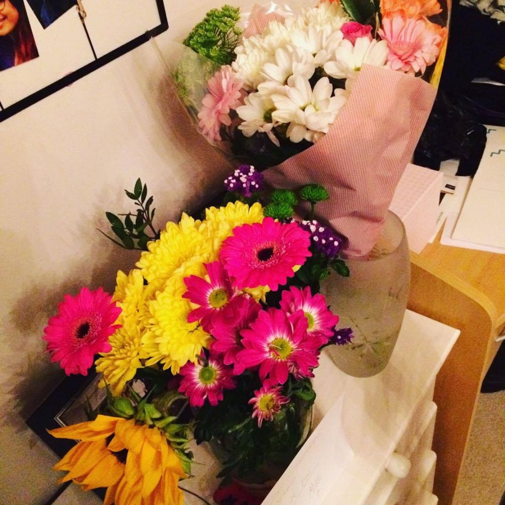 Flowers on a sideboard.