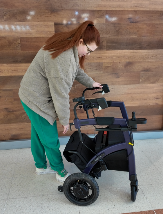 Jenni converting her rollz motion electric rollator from a rollator into an electric wheelchair