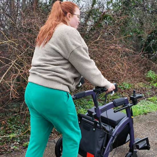jenni walking with her rollz motion electric rollator