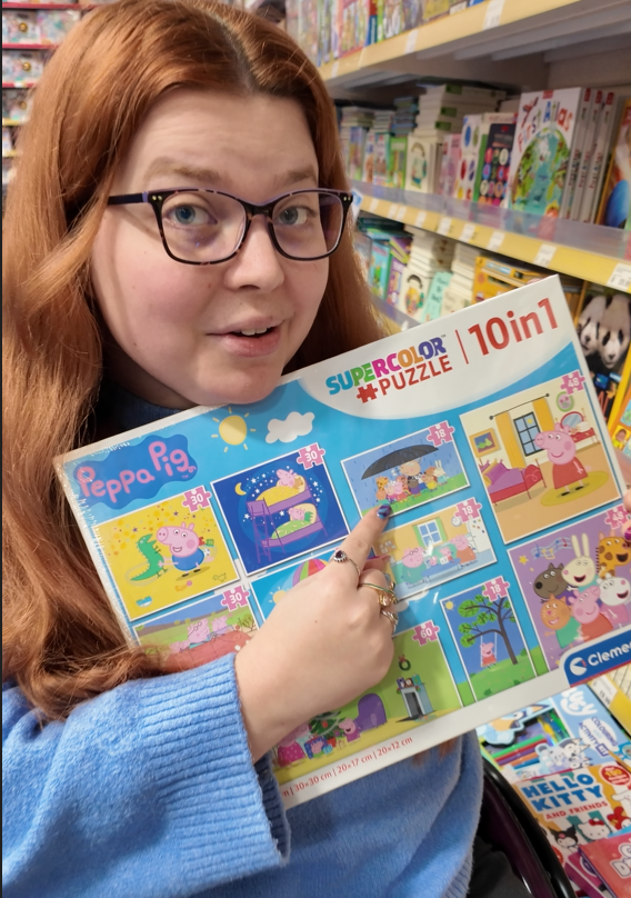 jenni holding a peppa pig puzzle