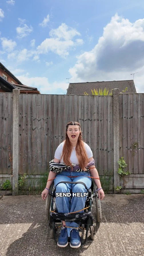 “Does it look like I’m bound?”

You’d be amazed how often people still use the phrase wheelchair bound. So I thought I’d show you what that would actually look like… and I think my neighbour nearly called the police when he drove round and saw me unable to move because I was tied to my wheelchair 🤣

Spoiler: I’m not tied to my wheelchair. I sleep in a bed, sit on the sofa, go to the loo — I just use it — to get around, to have independence, to live life on my terms. My wheelchair gives me freedom, not confinement.

Just like you’re not “glasses bound” or “shoe bound,” I’m not confined by any mobility aid. In fact, it’s the opposite — without it, I’d be far more limited.

The correct term is wheelchair user — because language matters. It shapes how disabled people are viewed, and whether we’re seen as stuck or supported.

Let me know in the comments some other language related to disability that needs to change and be sure to share with someone who still needs to unlearn this one.

#DisabilityEducation #WheelchairUser #Ableism101  #ChronicallyJenni #DisabilityAwareness #WheelchairLife