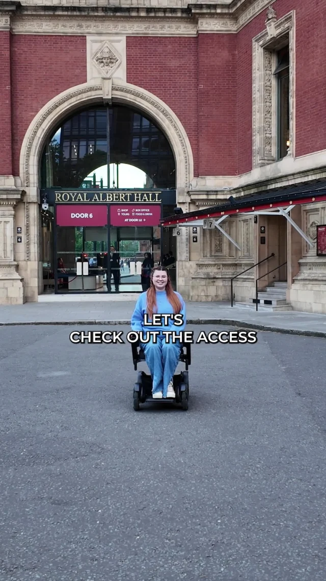 Let’s talk access at the Royal Albert Hall

Considering it’s such a historic venue, I was actually really pleasantly surprised by how physically accessible a lot of it was!

Blue badge parking is free and right outside the venue — which is fab — but the signage is seriously lacking. The entrance to the disabled car park isn’t where you’d expect (the obvious entrance is actually the exit), and once we got there, they asked us to awkwardly turn the car around to face the building, which made getting my wheelchair out a bit of a nightmare.

Once inside, there’s level access and automatic doors, which is a great start. It did take us a while to figure out where we were going and to find a route to an accessible bar, but every staff member we met was super helpful.

Getting into the auditorium was a bit of a squeeze — the doors to the seating area are really narrow. I needed both doors opened to get through, and I couldn’t do it independently. That said, other concertgoers and staff were quick to offer help, which was really appreciated.

The accessible toilet was okay , not amazing , but I did like the sliding door, which made it easier to get in and out on my own.

For this gig, which was a standing event, the only wheelchair spaces available were right to the side. That meant I had a pretty restricted view (especially with someone sitting directly in front of me) and got blasted by strobe lights the entire time, which made me feel really unwell, and I'm not usually photosensitive. Luckily the people in front left early so I could enjoy the end of the set with a clearer view.

Overall, the Royal Albert Hall is a beautiful and mostly accessible venue, especially considering its age. But like so many places, it’s the fine details; information & signage, seating positions, lighting considerations, that still need work.

Where should I review next? Drop your suggestions in the comments, accessible gigs and venues are out there, we just need to shout louder about them.

#AccessibilityReview #RoyalAlbertHall #DisabledAndProud #WheelchairAccess #DisabilityAwareness #AccessibleVenues #GigAccess #ChronicallyJenni #DisabilityRepresentation #AccessReview